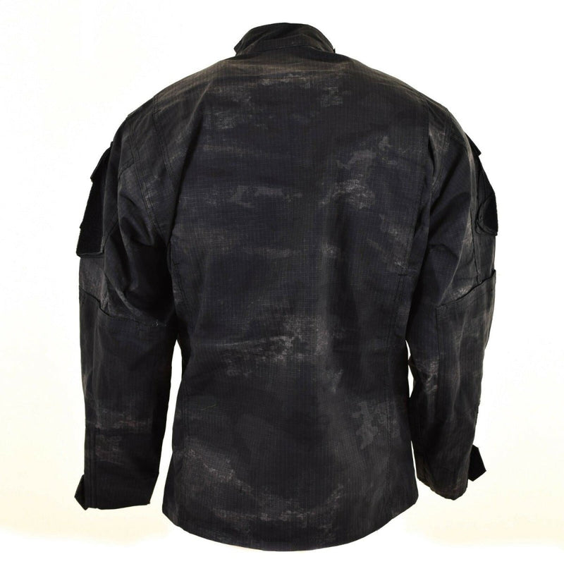 Back view of US style combat jacket in grey camo ripstop fabric with adjustable cuffs and pocket flaps