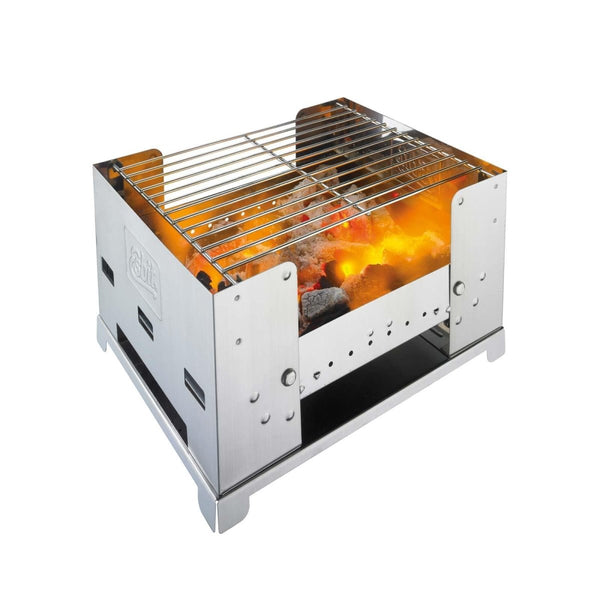 Compact fold-away stainless steel charcoal grill with glowing coals for outdoor cooking and picnics
