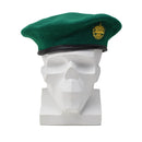 Genuine Austrian army green wool beret with a badge, lightweight and casual military-inspired headwear cap on white mannequin.