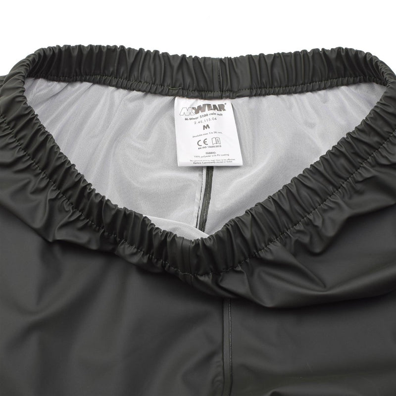 Close-up of elasticated waistband and interior lining of waterproof olive Belgian military wet weather pants