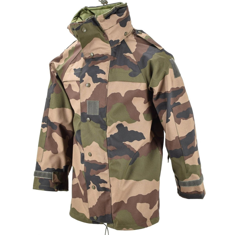 Genuine French Army waterproof trilaminate camouflage parka with hood, storm flap, and adjustable cuffs for outdoor protection.