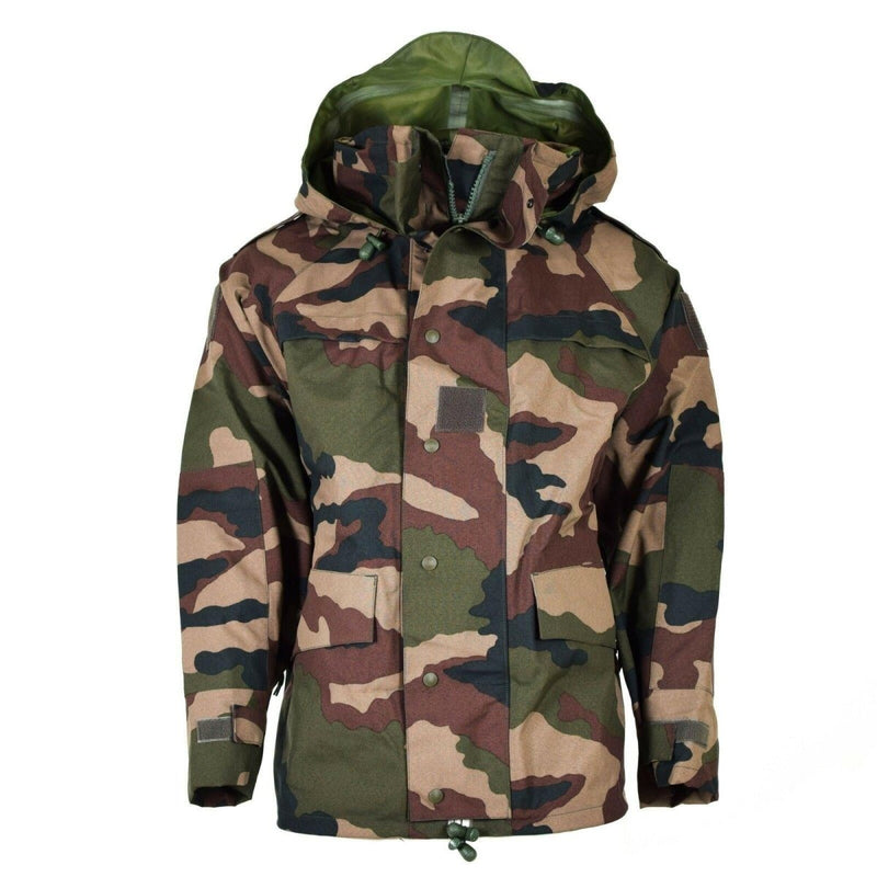Genuine French Army waterproof trilaminate camo parka with hood, storm flap, pockets, and adjustable cuffs for harsh weather.