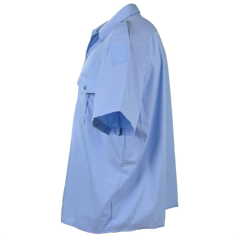 Side view of Genuine French Military Police blue cotton short sleeve shirt with epaulets and chest pockets.