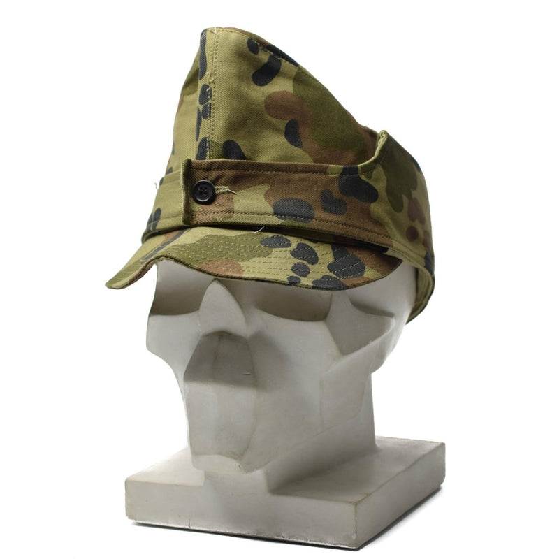 Romanian army field cap M93 in leaf camouflage with neck flap, displayed on white mannequin head.