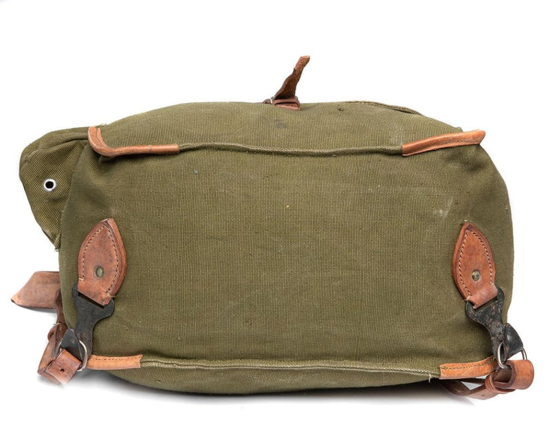 Genuine Romanian army rucksack bag in olive drab canvas with leather straps and metal buckle closures, military surplus gear.