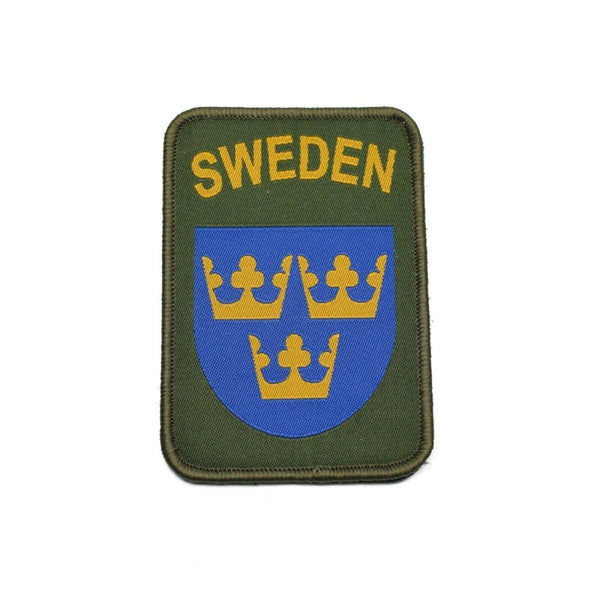 Sweden military patch with three golden crowns on blue shield and olive green background with SWEDEN text.