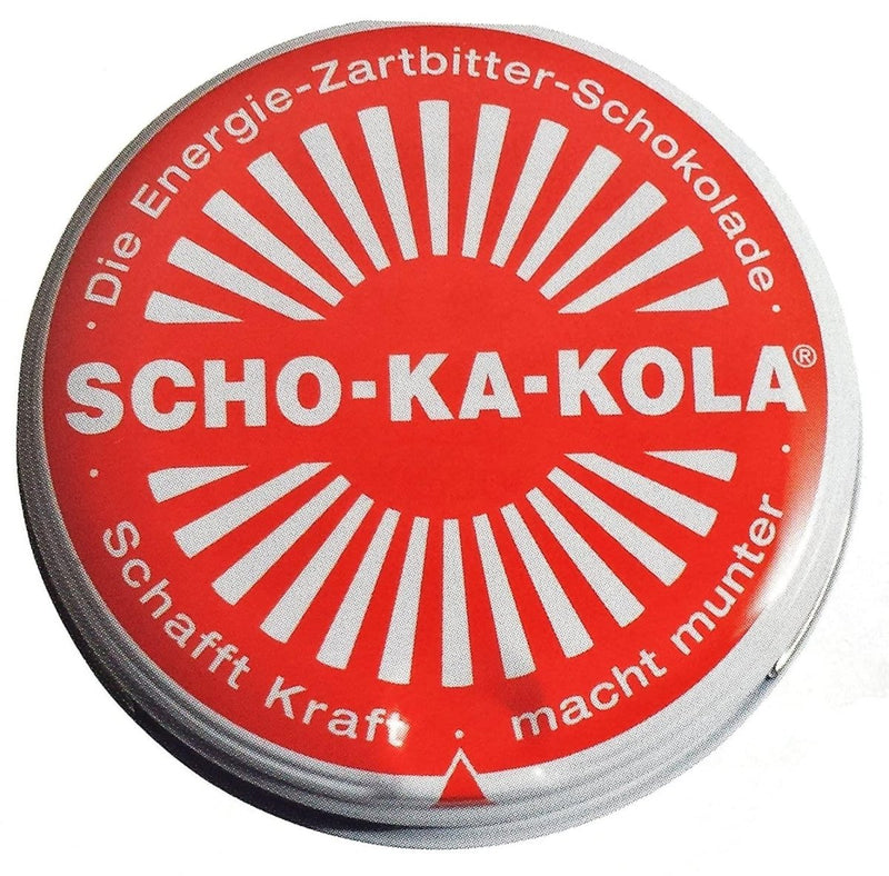 Round red tin can of German SCHO-KA-KOLA dark chocolate with caffeine and cola nut energy boost.