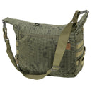 Green camouflage Helikon-Tex Bushcraft Satchel shoulder bag with adjustable strap and MOLLE webbing for outdoor use