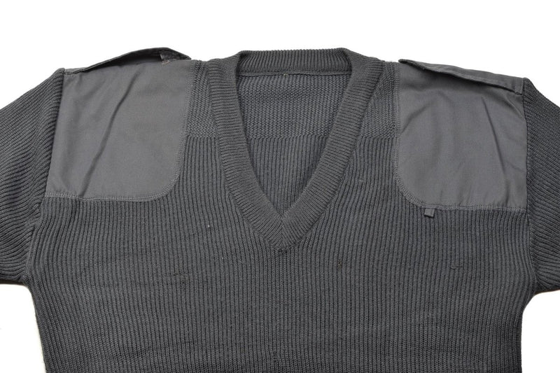Gray ribbed sweater with shoulder pads on a white background