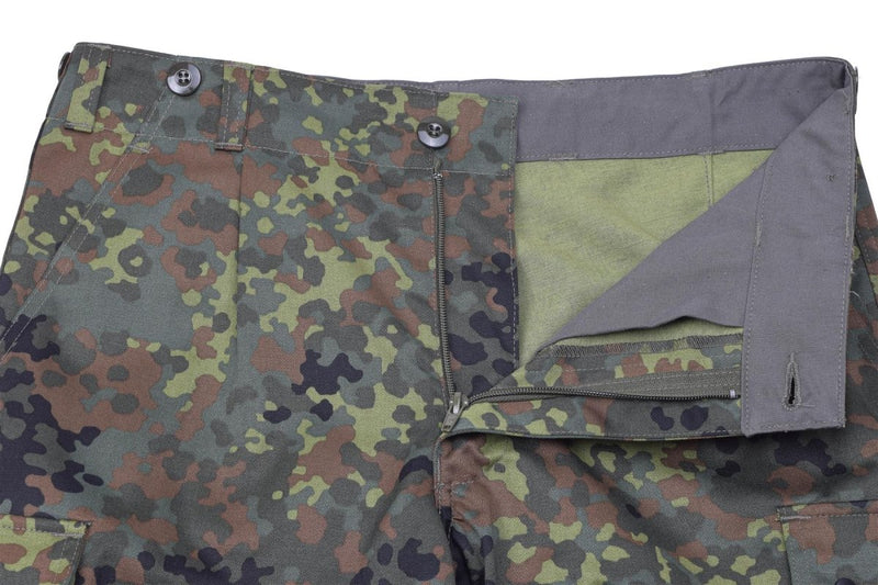 Close-up of Leo Kohler lightweight tactical airsoft pants in Flecktarn camo with button fly and belt loops visible.