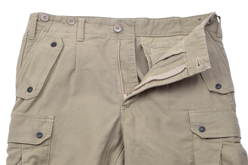 Khaki Leo Kohler Commando reinforced cotton BDU pants with multiple pockets and button details for durability and utility