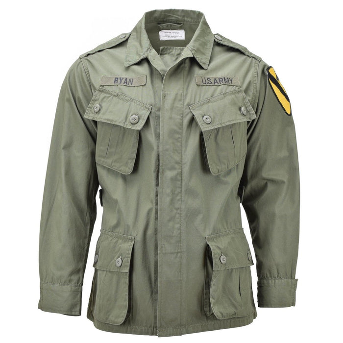 Mil-Tec U.S. Army Vietnam style M64 jungle jacket in olive drab with multiple pockets and military patches.