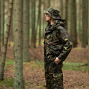 Man wearing Mil-Tec German army waterproof GoreTex Flecktarn parka and hat standing in forest