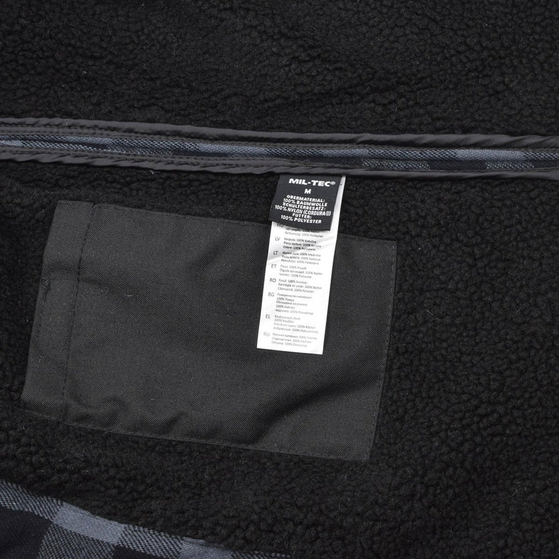Close-up of MIL-TEC German Military Lumberjack jacket inner pocket and label on warm black gray fleece lining