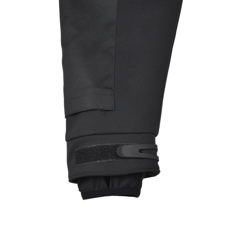 Close-up of adjustable cuff with Velcro strap on black MIL-TEC windproof and water-resistant activewear jacket sleeve.