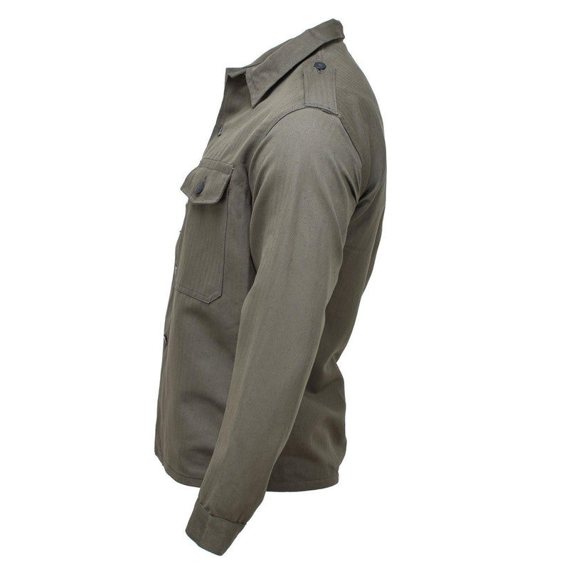 Side view of vintage olive green Austrian M59 military field jacket with buttoned chest pocket and collar