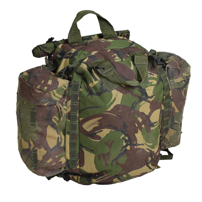Original British Military tactical backpack with camouflage pattern, multiple compartments, and padded shoulder straps for hiking and camping.