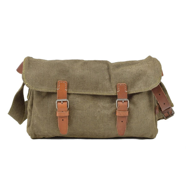 Vintage Czech military canvas shoulder bag with leather straps and sturdy buckle closures on white background