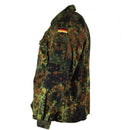 Side view of a German Army flecktarn camo tactical combat shirt with flag patch and multiple pockets