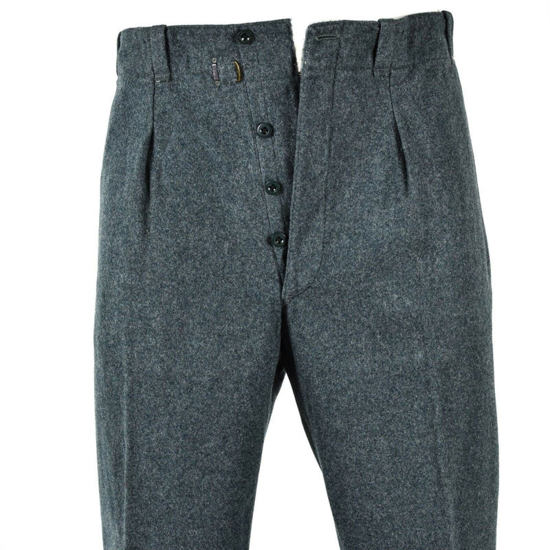 Gray pleated pants with buttons on a white background