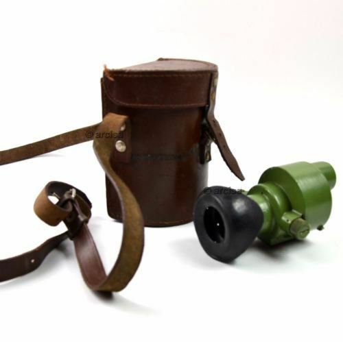 Original Yugoslavian army ON-M59 monocular with rubber eye cup and brown leather carrying case on white background.