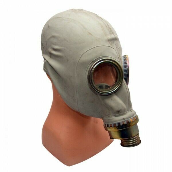 Vintage Polish MP3 MUA gas mask from 1970s with single front filter and large eyepieces on mannequin head