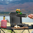 Primus Moja Stove compact outdoor gas burner cooking vegetables in pan by lake on portable camping table
