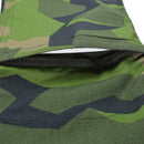 Close-up of TACGEAR Swedish Military style combat pants in Splinter camo showing ripstop fabric and leg pocket detail.
