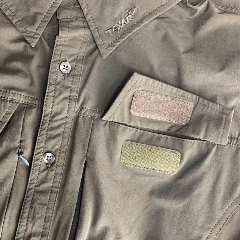Close-up of TEXAR long-sleeve military shirt showing buttons, collar, and dual patch pockets in durable fabric.