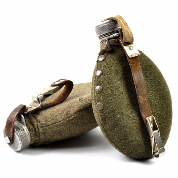 Original WWII Swedish Army metal drinking flask with wool pouch and leather strap for military use.